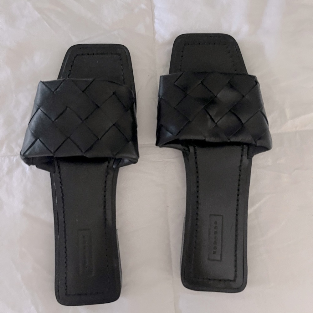 Black woven slides